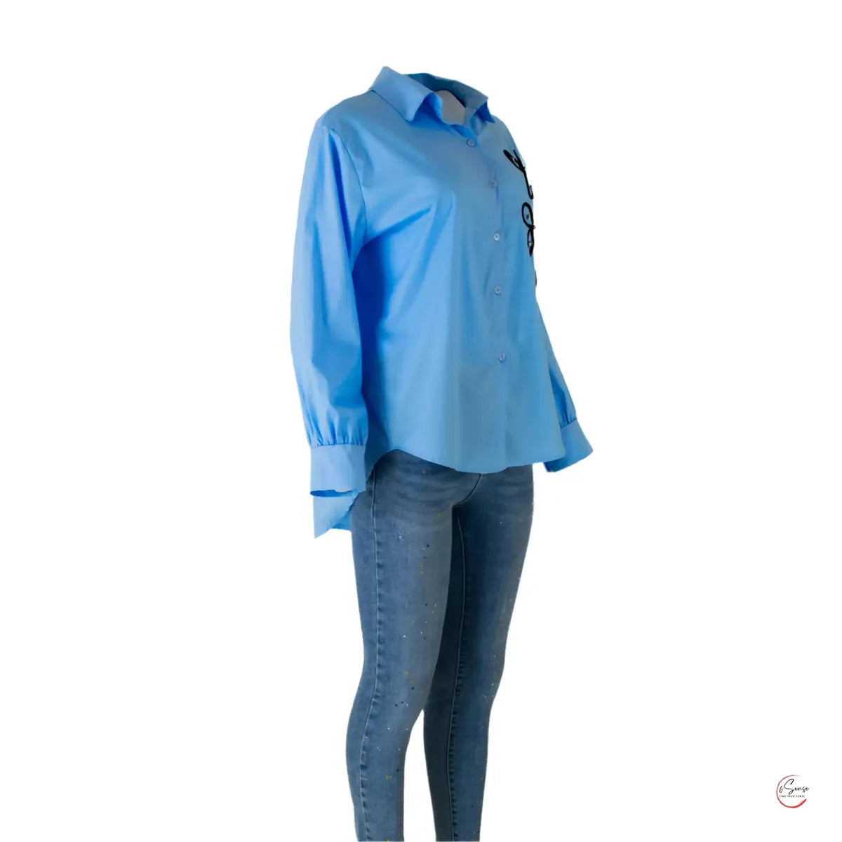 Stylish blue cotton shirt with 3D floral appliqué and beads, paired with jeans.