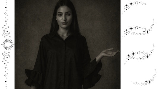 Мистична черно-бяла визия за статията „Страшни истории от модата“ – жена в тъмна риза със звездни и лунни символи, представена от 6sense.bg.