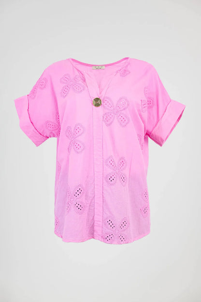 Vibrant pink Bloom Lace cotton shirt with intricate floral eyelet embroidery and a stylish V-neck.