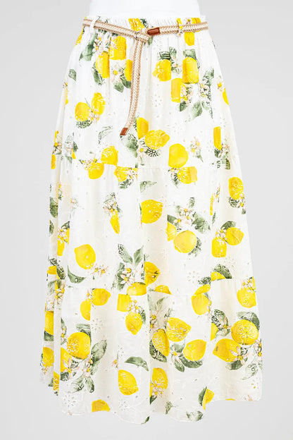 Chic white cotton midi skirt with vibrant lemon print, eyelet embroidery, and braided belt. Perfect summer style.