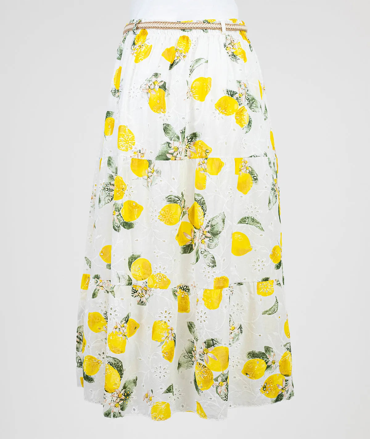 White cotton midi skirt with vibrant lemon print, tiered design, and braided rope belt.