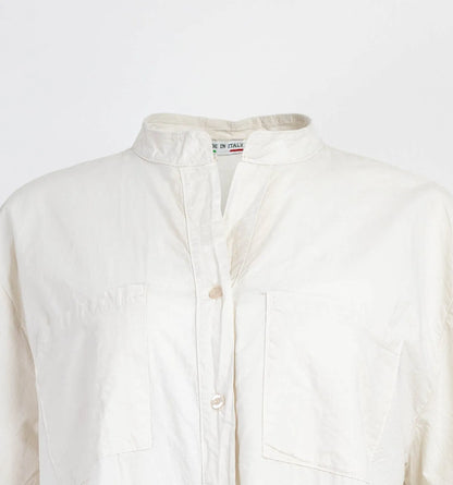 Chic white 100% cotton long shirt with mandarin collar, front buttons, and chest pockets.