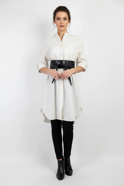 Elegant white 100% cotton long shirt/tunic, styled with a black obi belt, black pants, and boots.