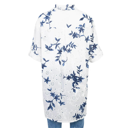White 100% cotton Sea Whisper summer shirt with elegant blue floral print, relaxed fit, and adjustable sleeves.