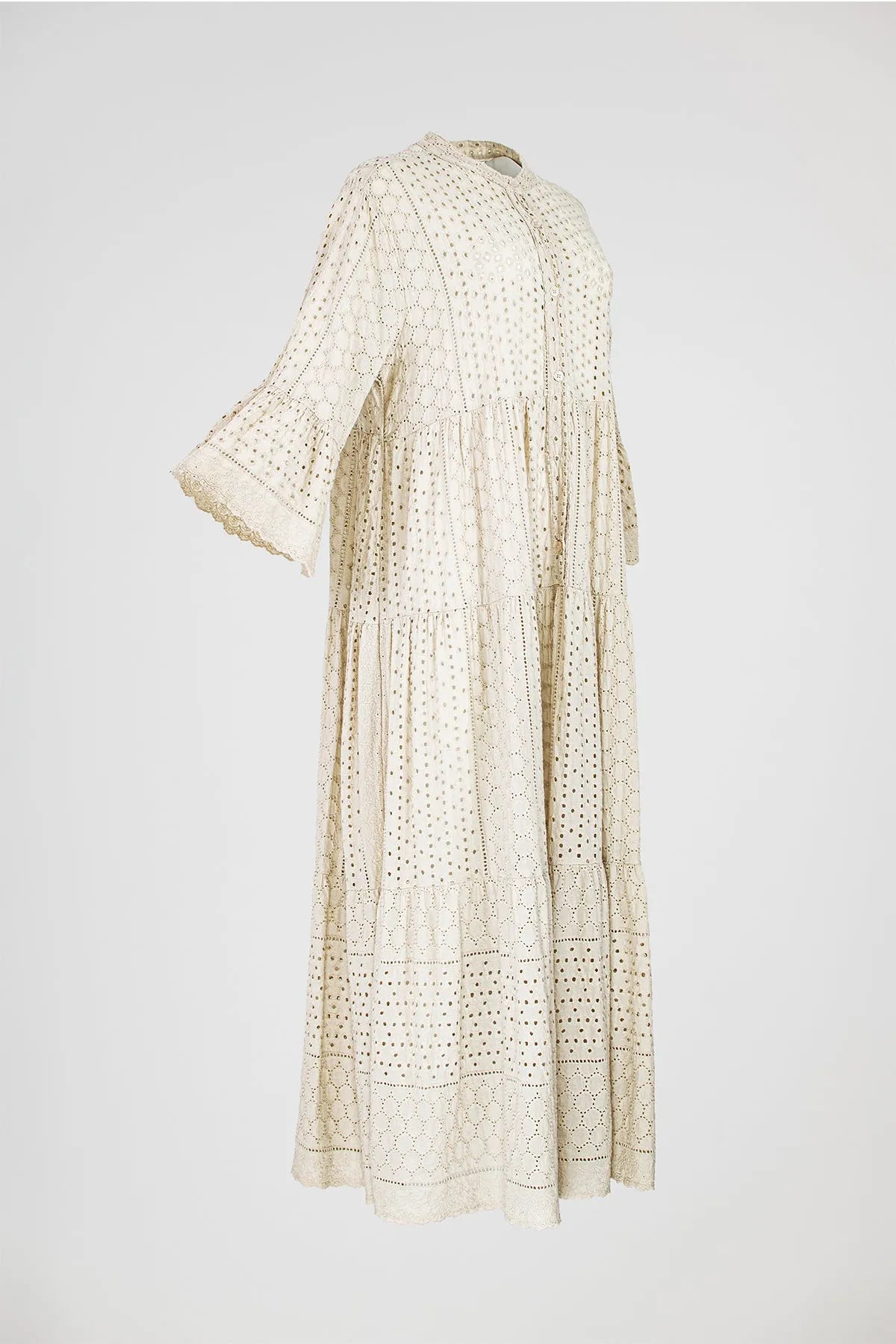 Boho Breeze natural beige cotton maxi dress with intricate eyelet embroidery, tiered skirt, and flared sleeves.