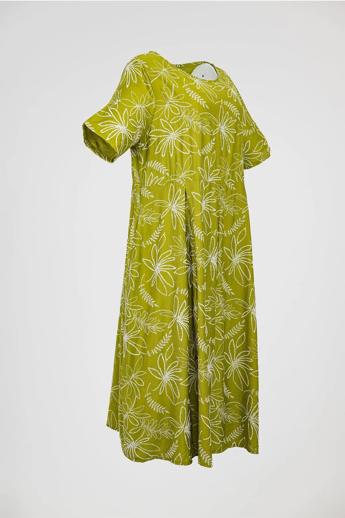 Flora Flow plus size olive green midi dress with white floral print, short sleeves, and flowing viscose fabric.