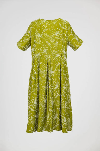 Chic olive green plus size Flora Flow dress with white floral print, short sleeves, and flowing midi length.