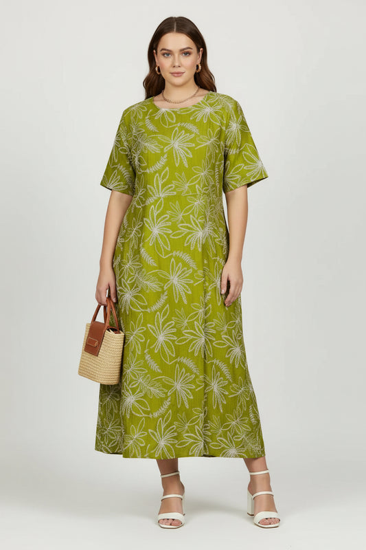Chic plus-size Flora Flow dress in olive green with white floral print, loose fit, and short sleeves.