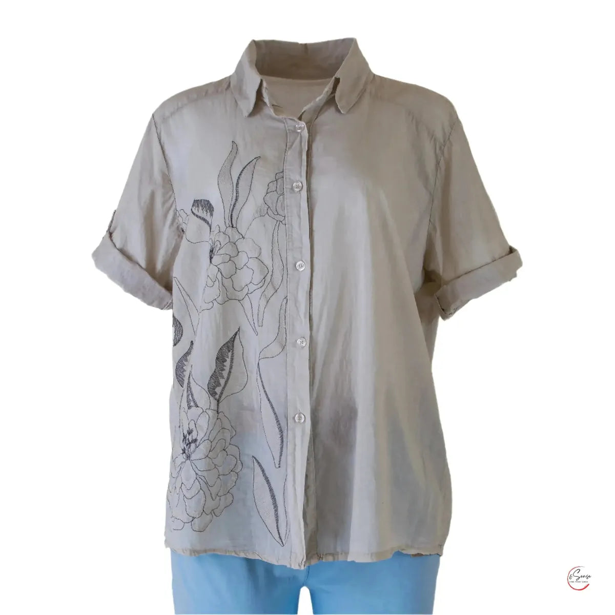 Stylish beige 100% cotton women's shirt with delicate floral embroidery and rolled short sleeves.