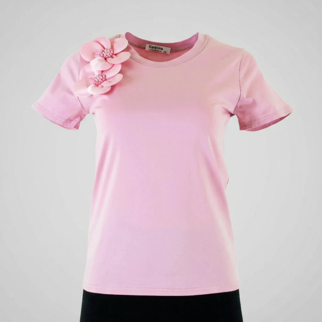 Chic pink women's t-shirt with elegant 3D floral appliques and bead details on the shoulder.