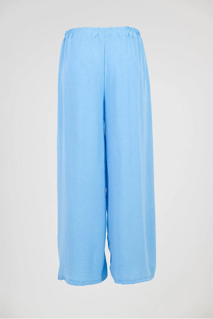 Sky Flow light blue wide-leg summer pants with elastic waist, perfect for comfort and style.