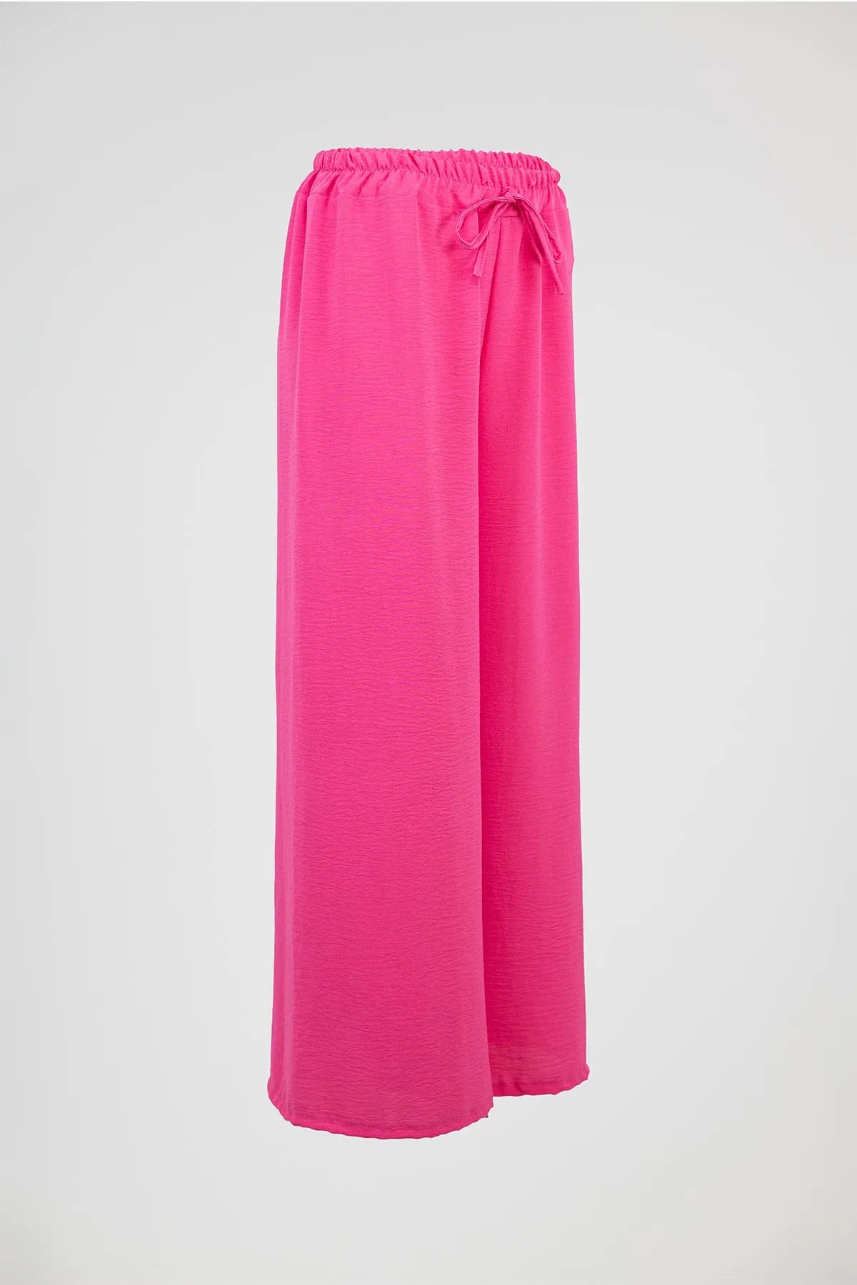 Vibrant pink wide-leg summer pants with elastic drawstring waist, perfect for comfort and style.