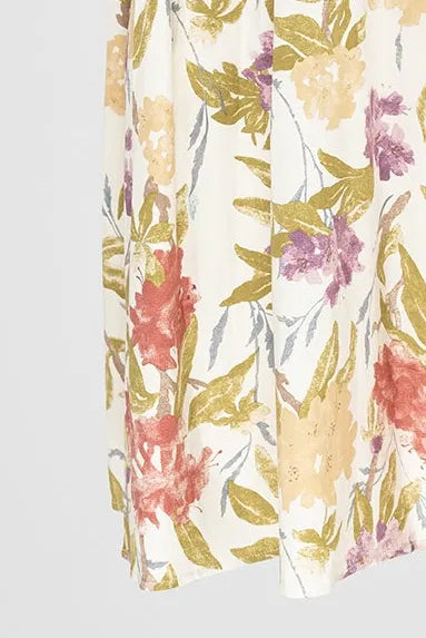Flora Muse рокля без ръкави, миди дължина, с флорален принт в пастелни тонове и колан.